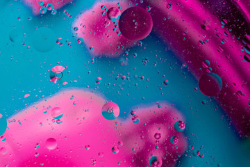 Micro molecular abstract pattern of colored oil bubbles on water. 