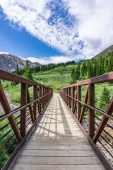 Fototapeta premium Stream bridge at beginning of Gray's Peak trailhead Colorado fourteener
