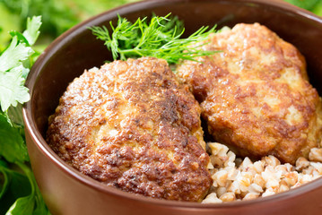 Homemade meatballs with buckwheat in a bowl.