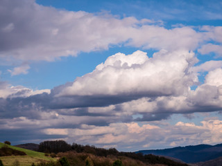 Massive clouds over mountainous landscape
