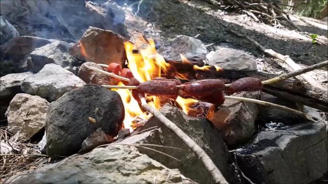 Turkish Sausage (sausage) cooking on fire.