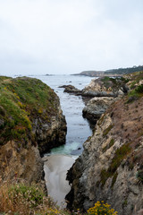 Fototapeta na wymiar A sandy cove below the Bird Island Trail at the Point Lobos State Natural Reserve in California.