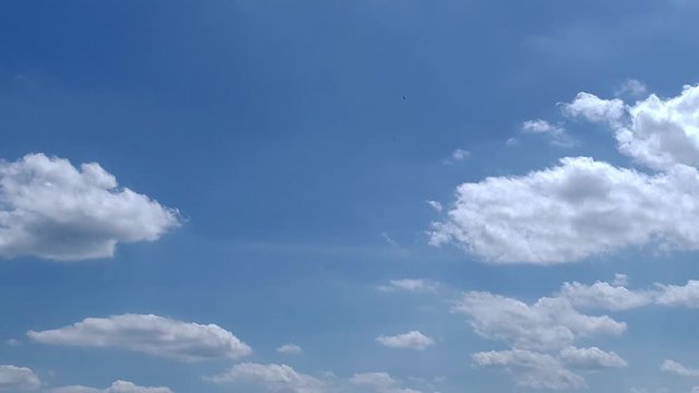 Slow Moving Clouds with Blue Sky on a Sunny Summer Day