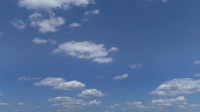 Slow Moving Clouds with Blue Sky on a Sunny Summer Day Left to Right