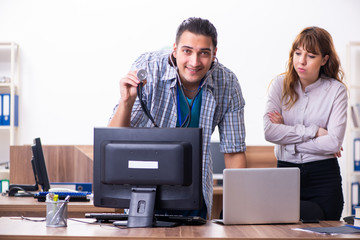 Young male it specialist in the office