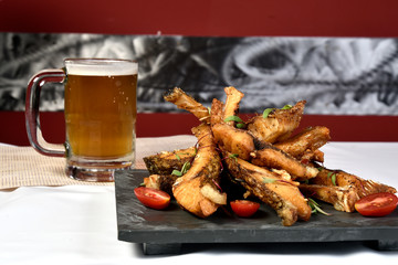 fried fish strips served on stone