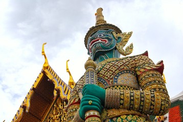 Fototapeta na wymiar The giant guard in front of the temple entrance gate. Traditional art of Thailand.
