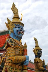 The giant guard in front of the temple entrance gate. Traditional art of Thailand.