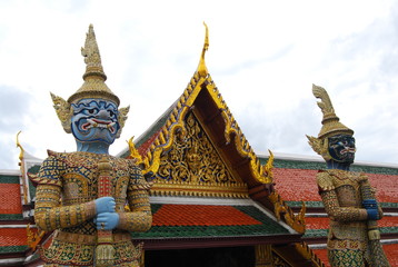 Fototapeta premium The giant guard in front of the temple entrance gate. Traditional art of Thailand.