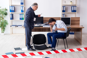 Forensic investigator investigating theft in the office