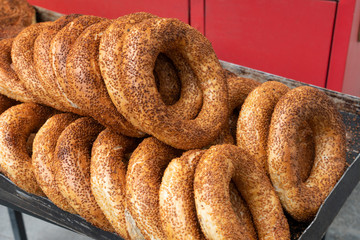 Circular sesame bread Turkish style called as Simit on street food shop in Turkish. Round sesame bread on tray.