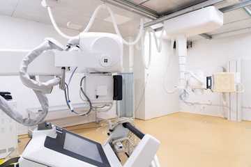 X-ray machine with control panel and scanning screen in modern clinics
