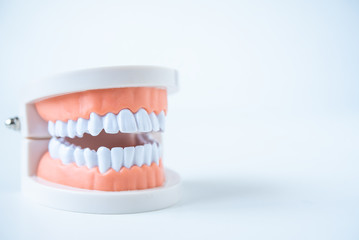  close up dentist  tools for teeth care at white background top view