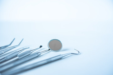  close up dentist  tools for teeth care at white background top view