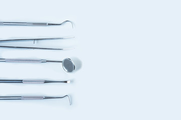  close up dentist  tools for teeth care at white background top view