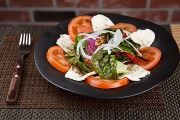 Tomato cheese salad on a plate