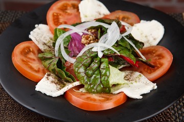 Tomato cheese salad on a plate