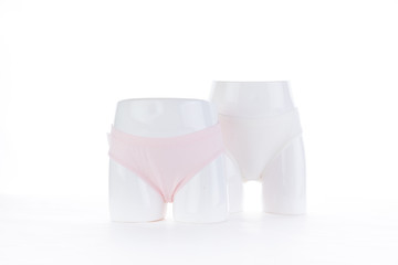 Exquisite pink underwear is displayed on the counter of the store. Choose pure cotton underwear for health.