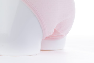 Exquisite pink underwear is displayed on the counter of the store. Choose pure cotton underwear for health.