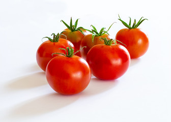 small red cherry tomatoes on white background