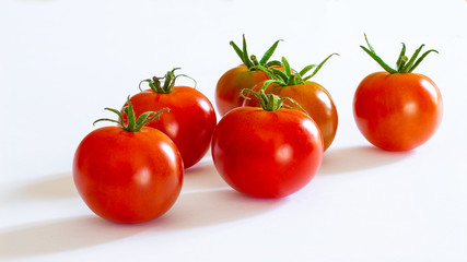 small red cherry tomatoes on white background