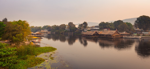 Naklejka na ściany i meble Sunrise over the river Kwai, Kanchanaburi, Thailand. Panorama