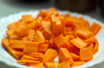 Sliced carrots on a plate close-up, shallow depth of field