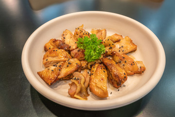 Korean fried chicken with soy sauce decorated with parsley 