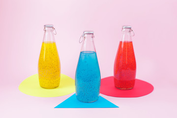 Summer refreshing drink in the bottles with basil seed