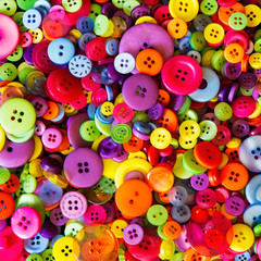 Fototapeta na wymiar Top view of a pile of buttons; background of colorful buttons