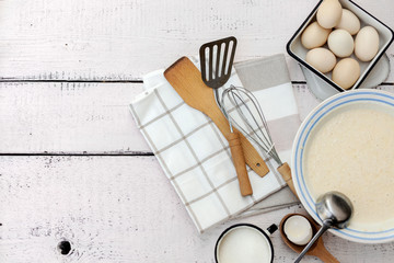 Cooking dough for pancakes. Rustic style, vintage utensils for the kitchen.
