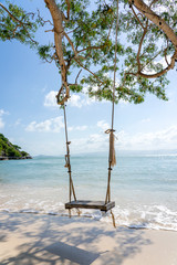 Swing hang from tropical tree over summer beach sea in Koh Phangan island , Thailand. Summer,...