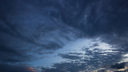 Fototapeta na wymiar dramatic sky with clouds at sunset