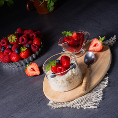 delicious milk rice with different berries and red fruit jelly