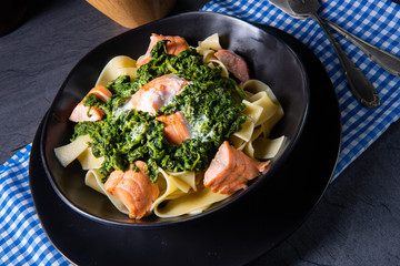 pappardelle pasta with creamed spinach and fried salmon
