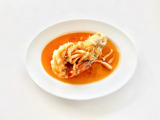 the plate with big shirmp and soup