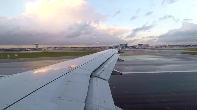 Airplane take off in beautiful sky with clouds, view from window sit