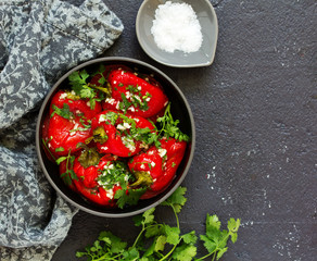 Baked bell peppers salad with herbs and garlic. Eastern dish.