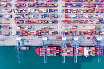 Fototapeta na wymiar Top view of Deep water port with cargo ship and containers. It is an import and export cargo port where is a part of shipping dock and export products worldwide
