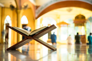 Quran, a muslim holy text book, central religious text of Islam, which Muslims believe to be a revelation from God