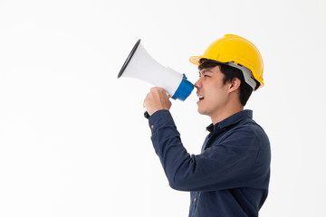 Asian young engineer with yellow helmet hold a megaphone in hand to issuing order for construction isolated on white background with copy space