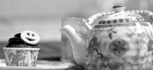 pastry, cup of tea with teapot