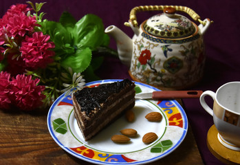 tea pot, cup of tea and cookies