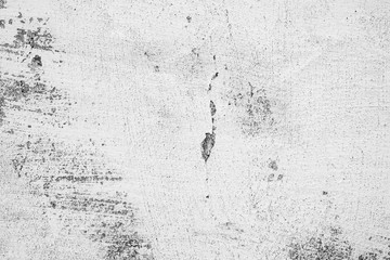 Texture of a concrete wall with cracks and scratches which can be used as a background