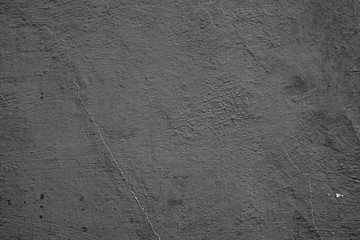 Texture of a concrete wall with cracks and scratches which can be used as a background