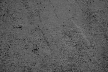 Texture of a concrete wall with cracks and scratches which can be used as a background
