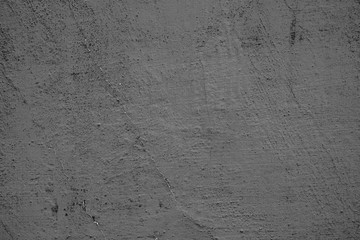 Texture of a concrete wall with cracks and scratches which can be used as a background