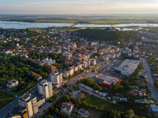 Aerial view of Slatina city and river Olt, Romania. Drone flight over the european city in summer day.