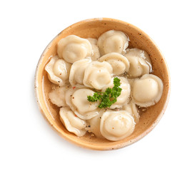 Bowl of tasty dumplings in broth isolated on white, top view