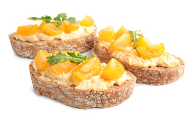 Tasty fresh tomato bruschettas on white background